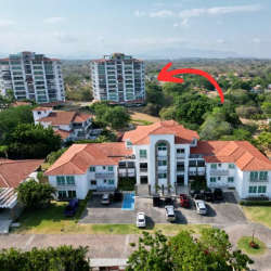 Comfortable bedroom featuring ocean views, large window, tile flooring in Punta Barco Village San Carlos Panama