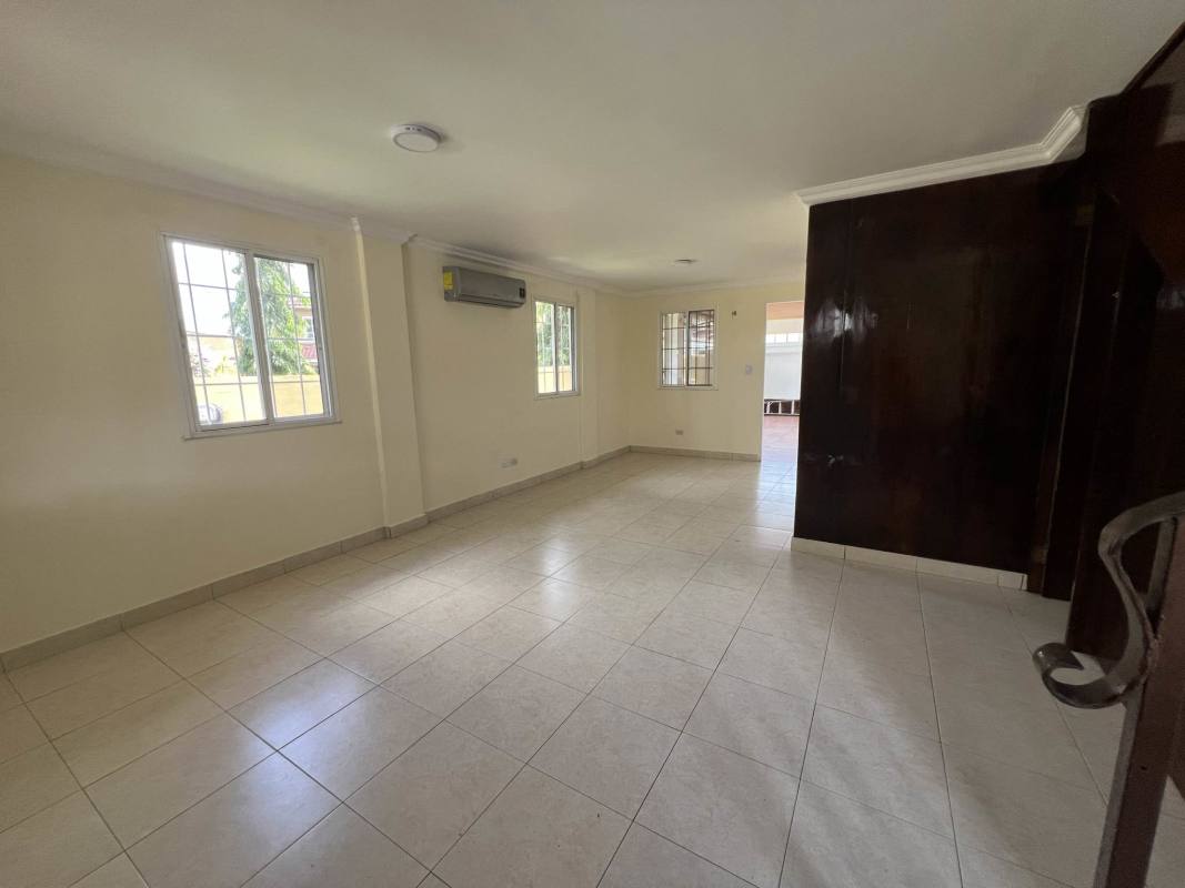 Spacious living room with air conditioning, tiled floors, large windows in Dorado Lakes, Panama City