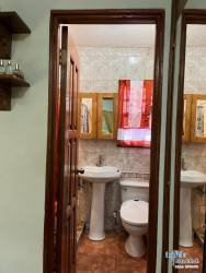 Wood cabinetry kitchen with island, granite-look counters and appliances David Chiriquí