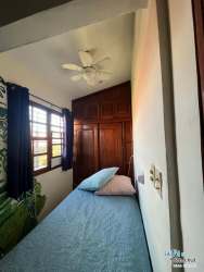 Bedroom with ceiling fan, built-in closet, window facing garden in Cuesta del Sol Panama