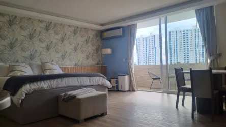 Sleeping area with king bed sofa bed balcony ocean view, Playa Blanca Loft