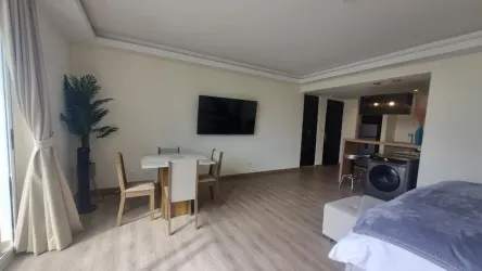 Open plan living dining area with balcony in vacation loft Playa Blanca