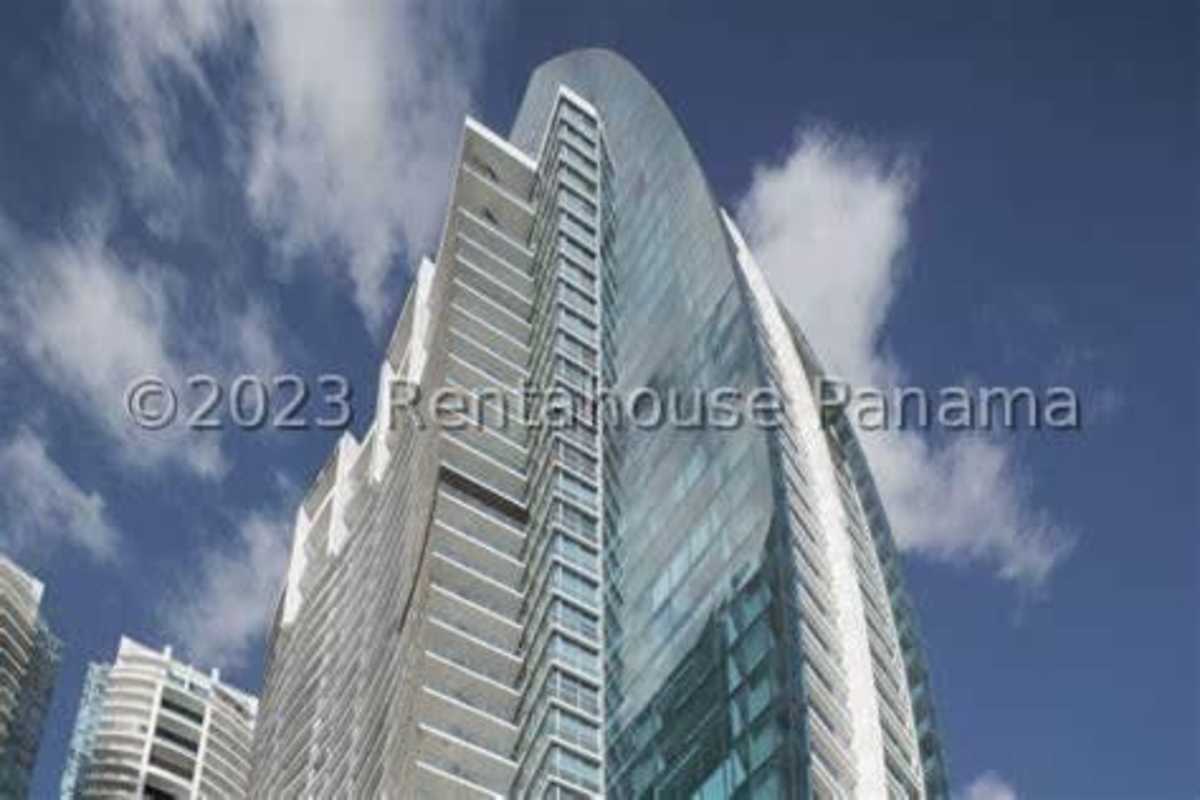 Bright living room with floor-to-ceiling windows open to ocean view balcony PH Aqualina Panama