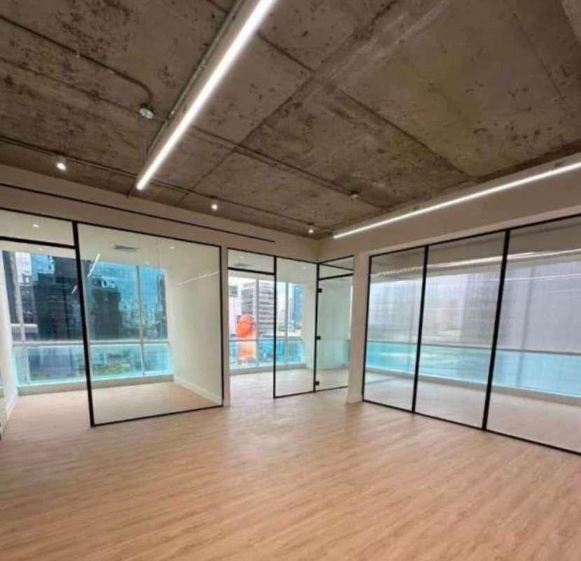 Open plan office with exposed ceiling and glass dividers PH BICSA Tower Obarrio Panama City