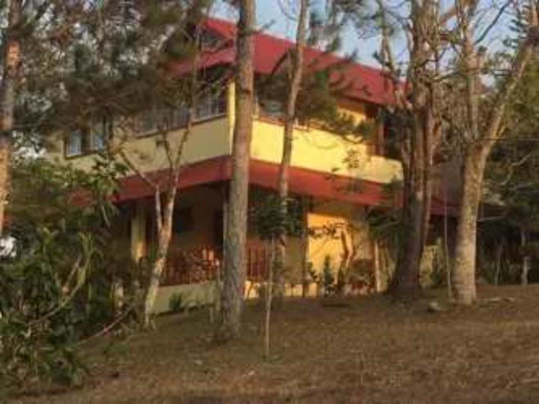 Rustic mountain kitchen with granite countertops breakfast bar exposed beams Panama