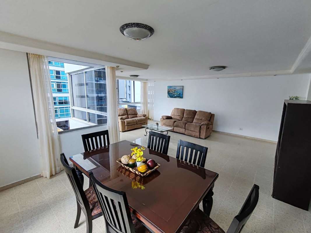 Living room with large windows, panoramic ocean views, contemporary design in PH Torre Marbella Vista Panama