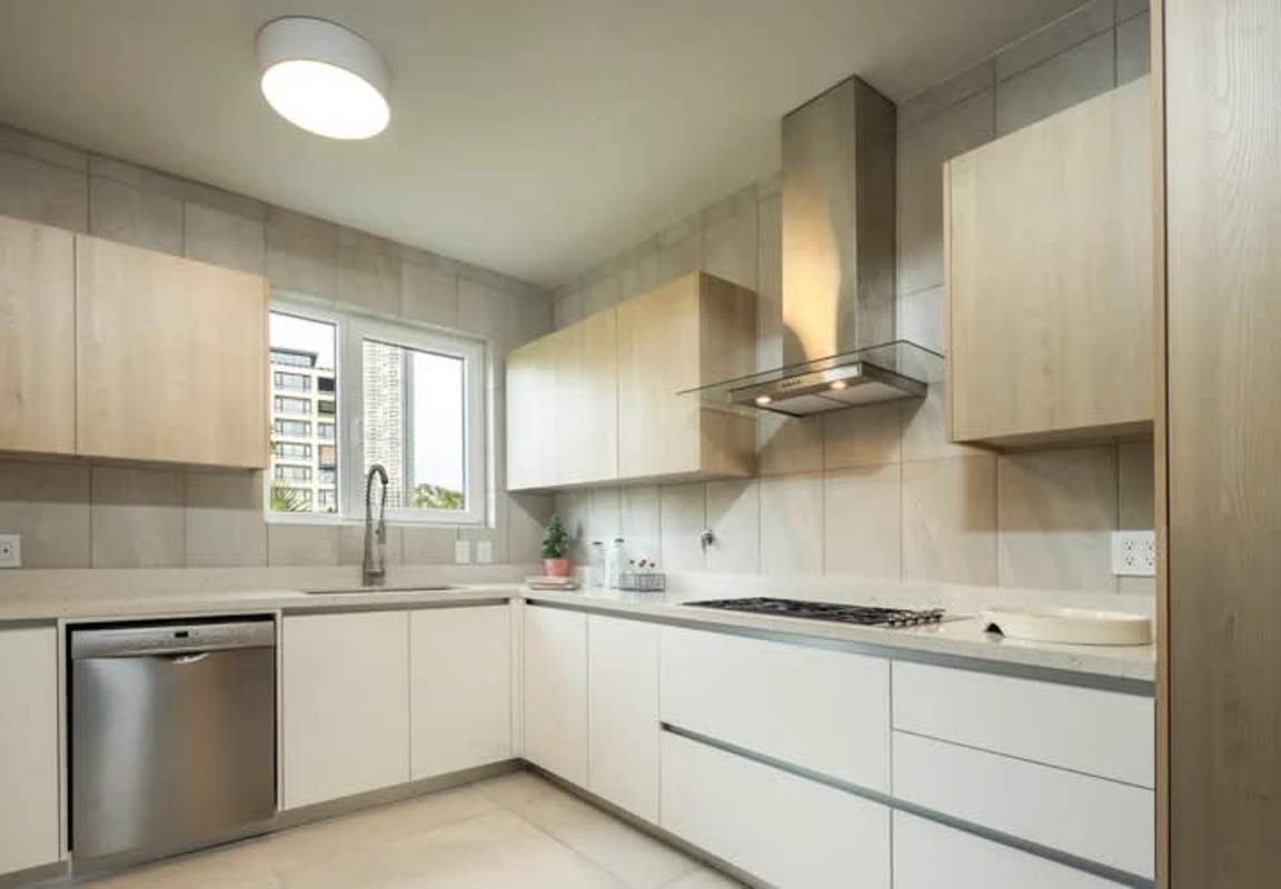 Luxury kitchen with granite countertops, stainless appliances in upscale duplex at Santa Maria Golf Panama City