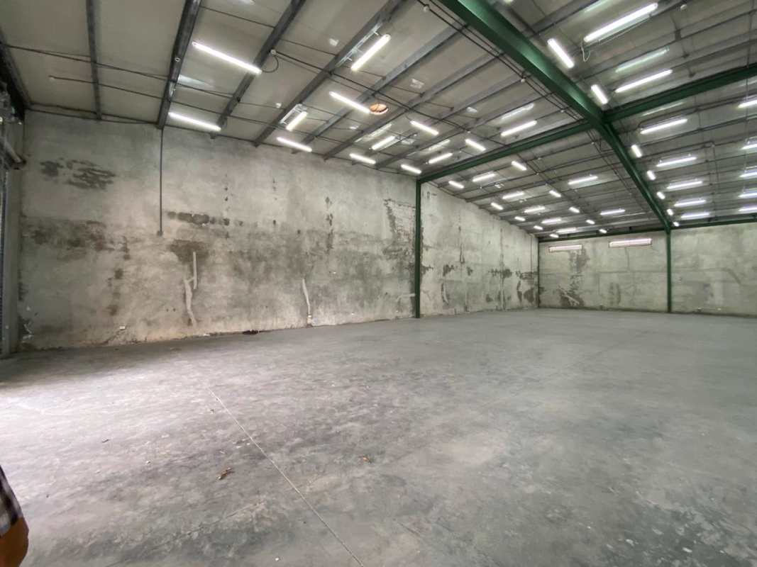 Wide open empty warehouse space with concrete floor and unfinished walls Panama