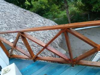 Rustic interior with unique burnt wood floor Punta Chame Panama home for sale