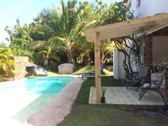 Swimming pool and wooden pergola with lush garden Punta Chame Panama