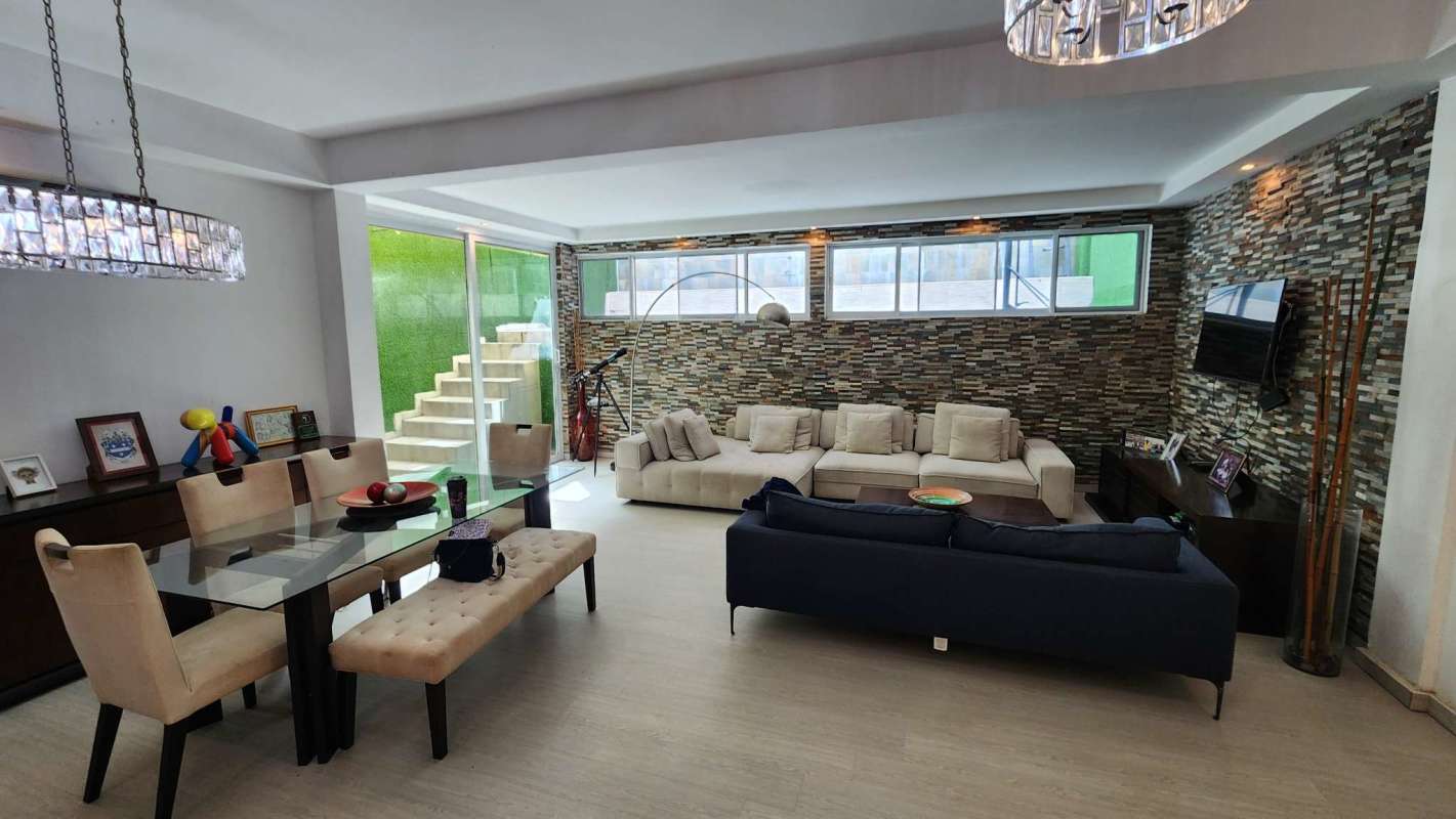 Modern open plan living dining with accent wall in Limajo Condado del Rey Panama house for sale
