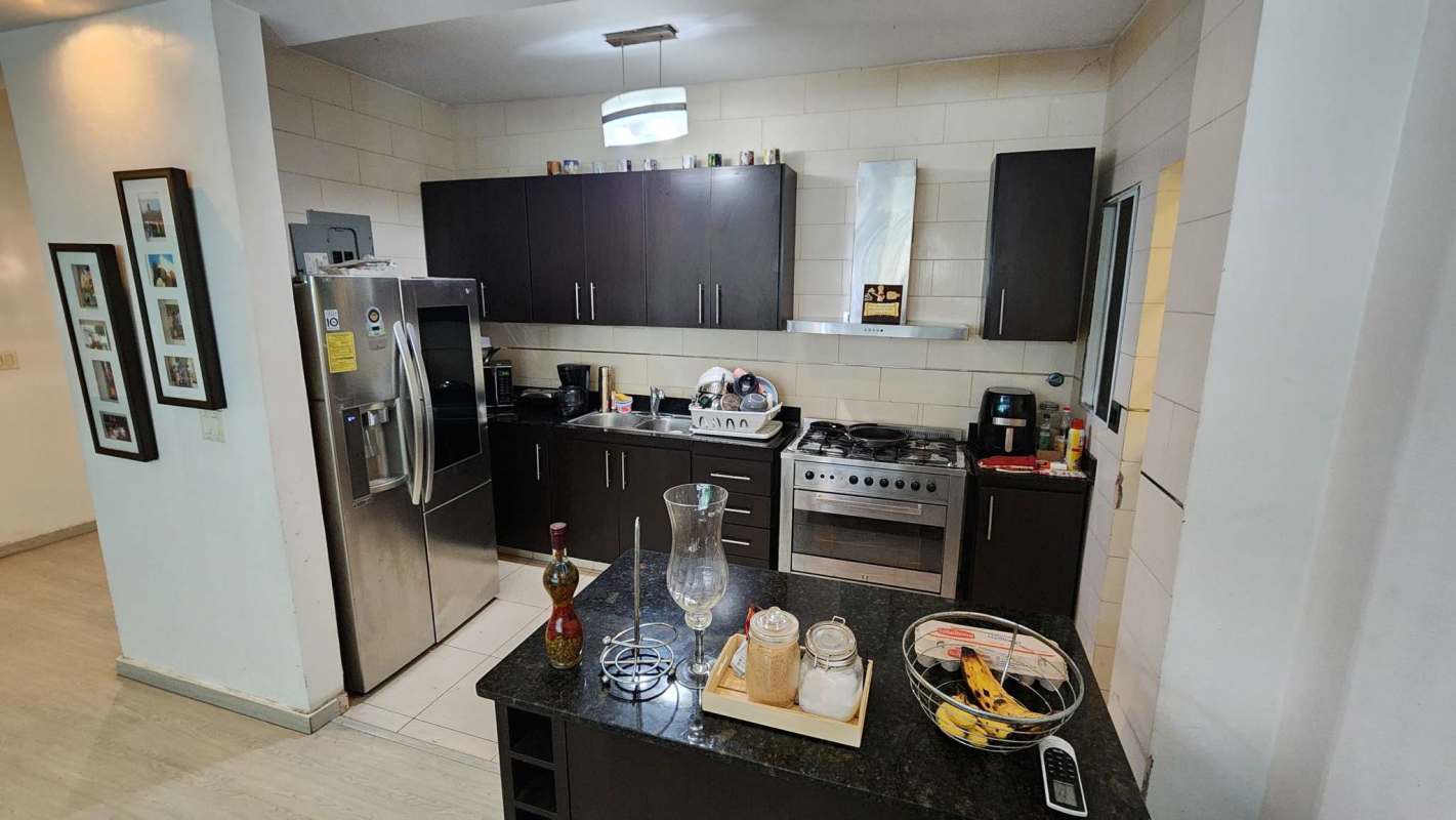 Spacious bedroom with accent ceiling and neutral decor Limajo Panama house