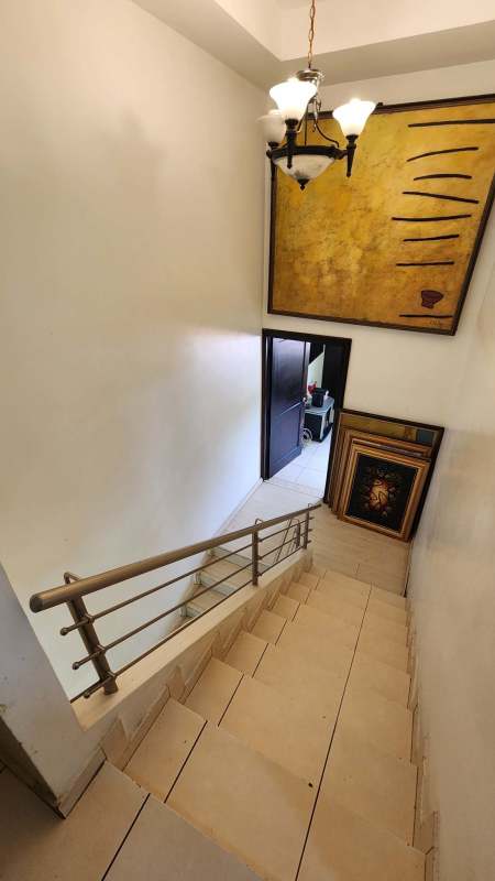 Contemporary bathroom with glass shower and stone tiles Limajo Panama house
