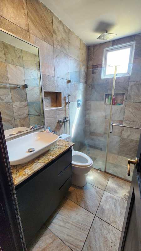 Paved courtyard with basketball hoop and satellite dish Limajo Panama