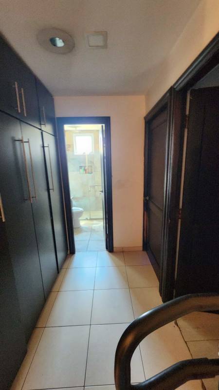 Interior hallway with dark built-in wardrobes and access to bathroom Limajo Panama
