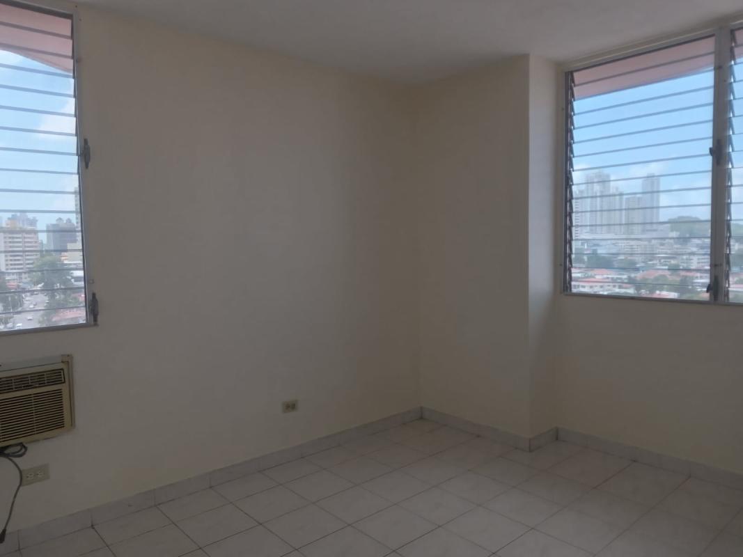 Minimal bedroom design tile floors bright window Vista Hermosa Panama