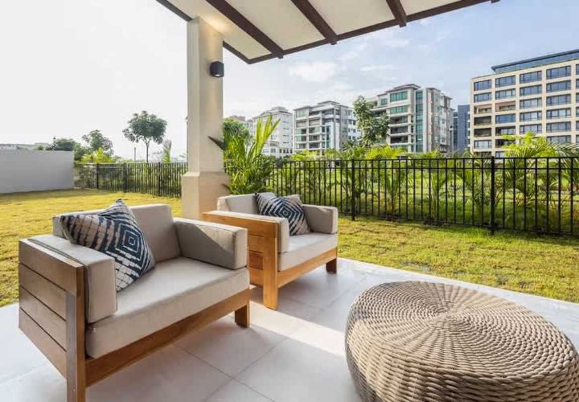 Covered terrace perfect for entertaining and relaxing with garden views at The Woods Panama