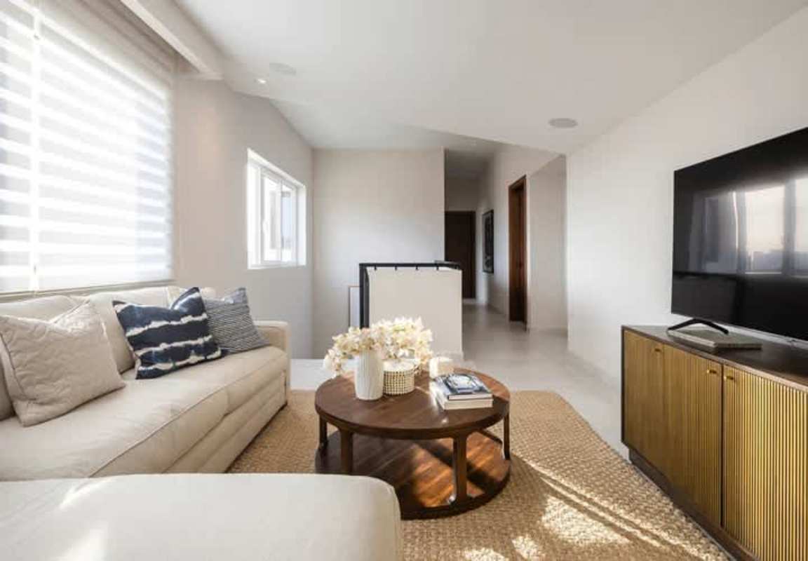 Contemporary kitchen with quartz countertops, custom cabinetry in The Woods Santa María Panama