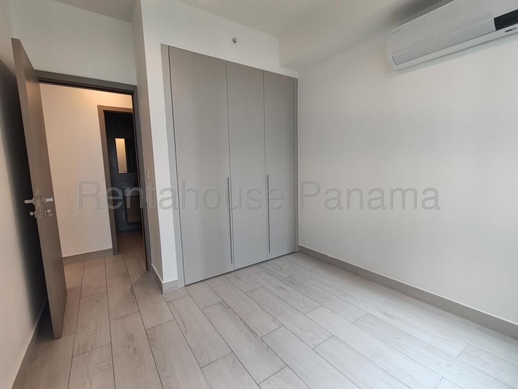 Bedroom featuring split AC, tile floors, built-in closet in PH Urbana Obarrio Panama City
