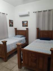 Furnished living and dining room with TV, Wi-Fi and AC in Coronado Equestrian Club vacation rental Panama