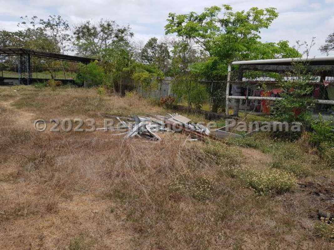 Industrial yard with metal frame shelter grassy area 24 de Diciembre Panama