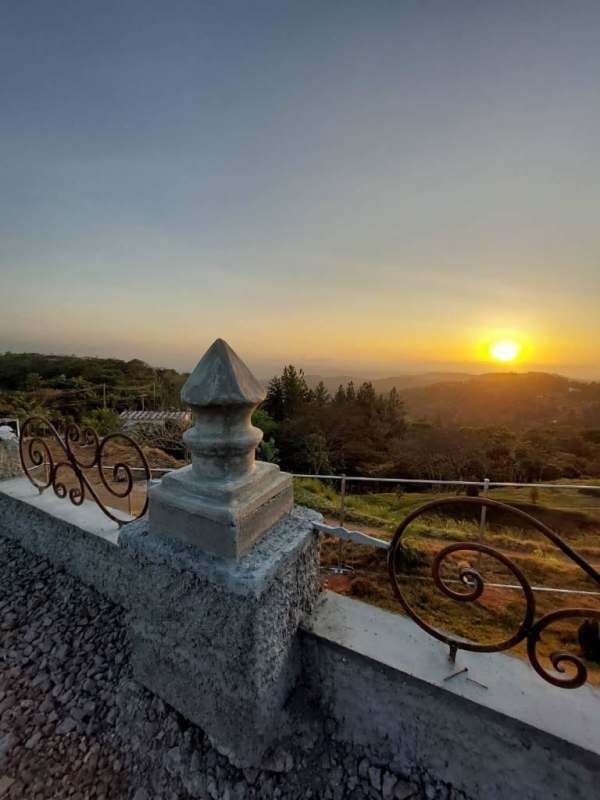 Mountain landscape sunset with stone and wrought iron fence at Las Vistas Cerro Azul Panama