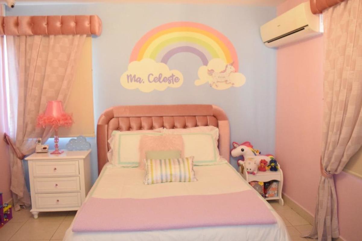Master bedroom featuring beige upholstered headboard, pendant lights, PH Condado del Rey Panama