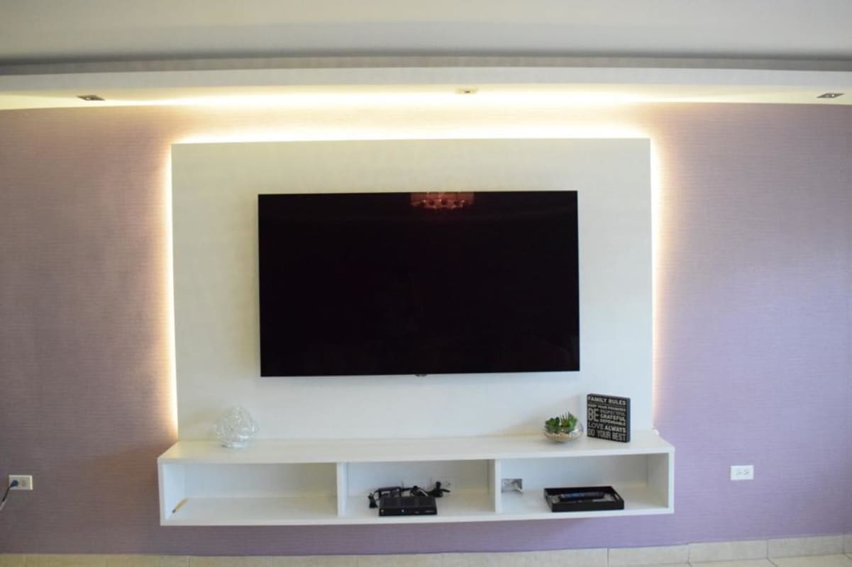 Modern TV media wall with LED lights PH Condado del Rey Panama