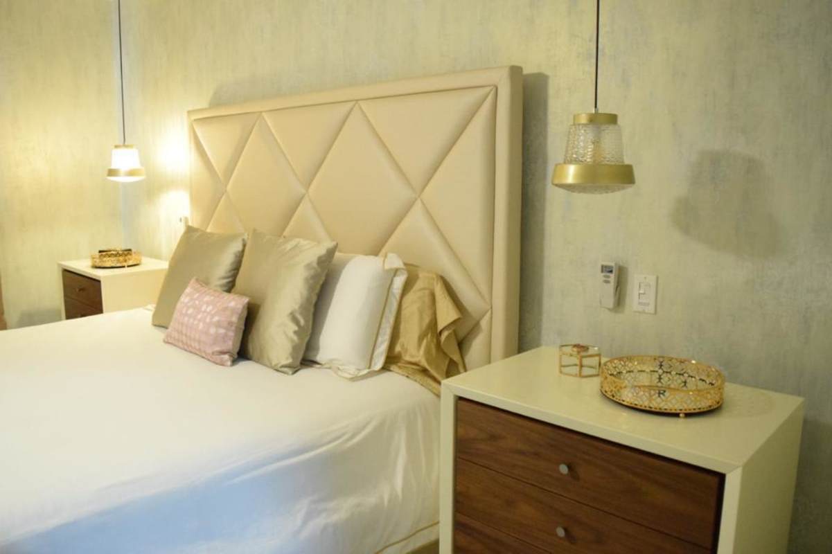 Children's bedroom with pastel mural, tufted headboard PH Condado del Rey Panama