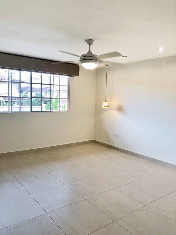Spacious living room with large sliding door, recessed ceiling, PH Condado del Rey Panama
