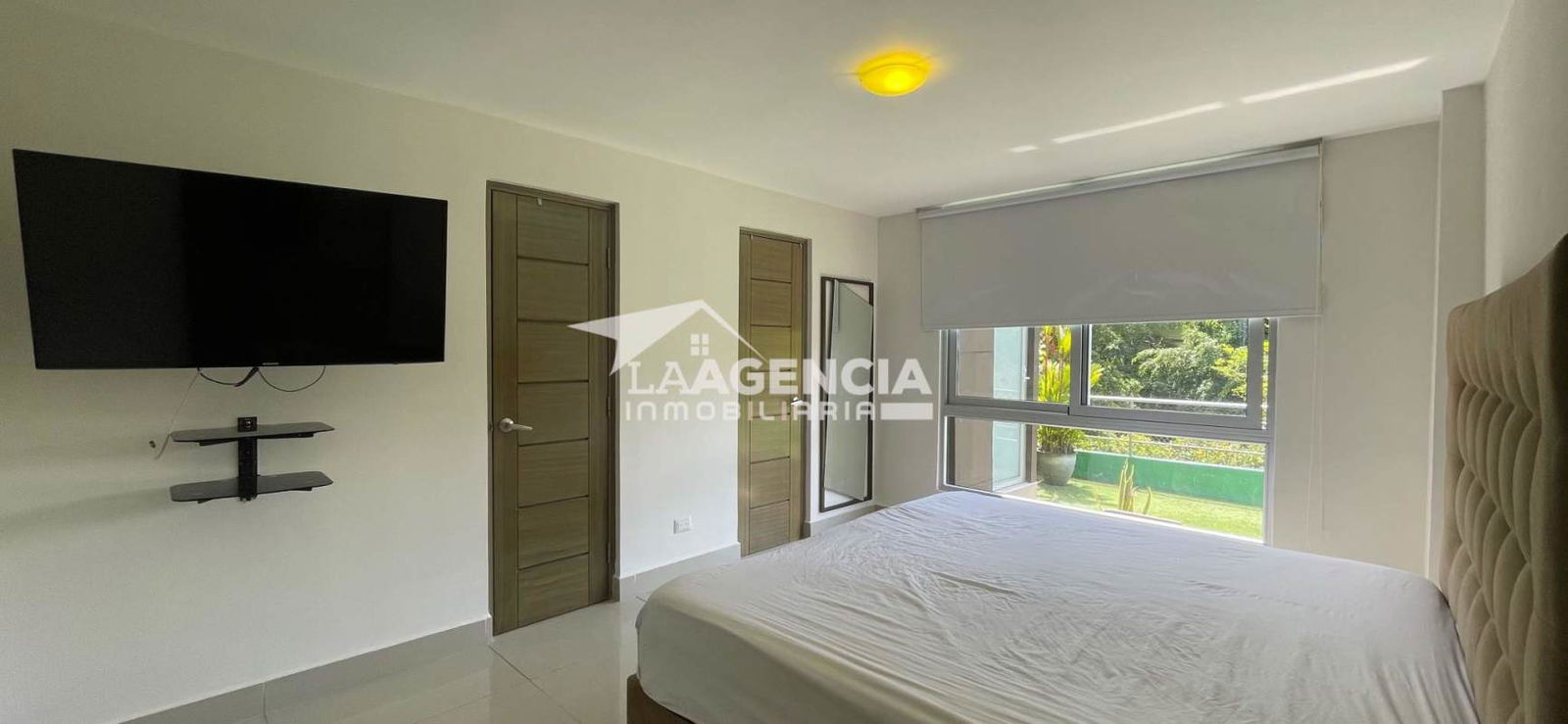 Modern furnished bedroom with garden view and natural light Clayton Hill Residences Panama