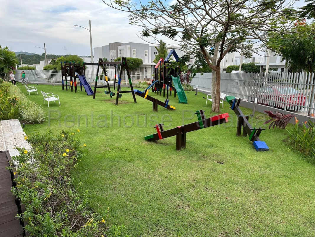 Outdoor swimming pool, sun umbrellas, children's play area in PH Victoria Gated Community Brisas del Golf Panama