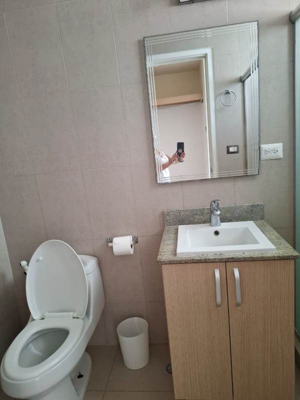 Bathroom with granite countertop sink and large mirror in PH Rokas Condado del Rey apartment