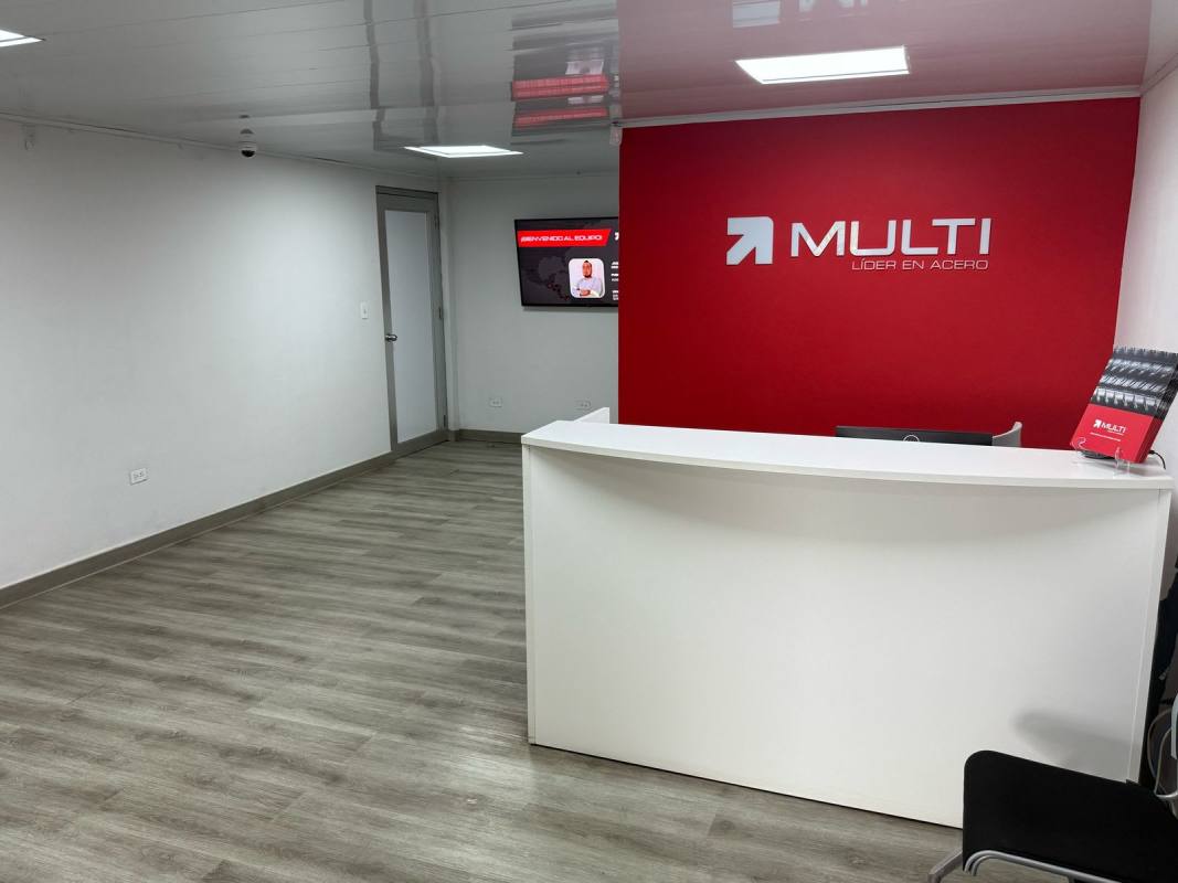 Reception area with desk and signage in warehouse office Panama City