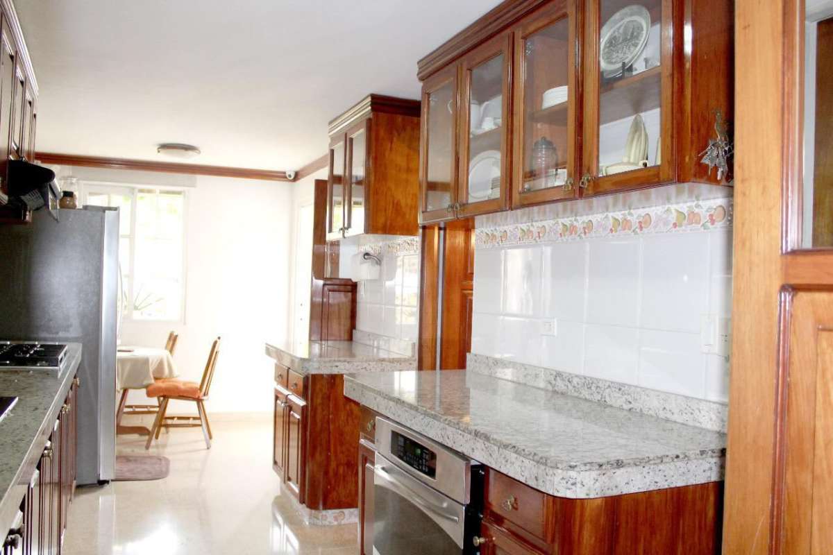 Traditional kitchen with wooden cabinets, granite counters Betania Panama