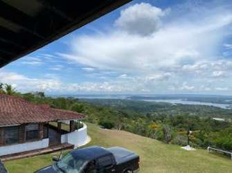 Single story house in countryside property overlooking valley and water, Santa Rita Colón Panama