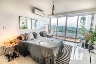 Living room with dining area, large windows, ocean views Casa Bonita Panama