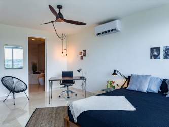 Spacious bedroom with large windows and ocean views Casa Bonita Panama