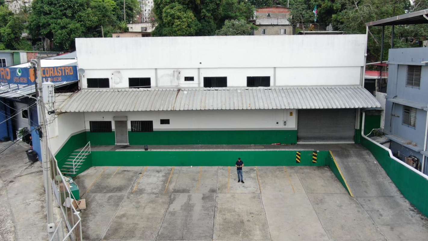 View of industrial warehouse exterior with green and white facade at 12 de Octubre Panama