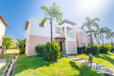 Bright open-plan living room with large windows and views at Costa Blanca Golf Resort Panama