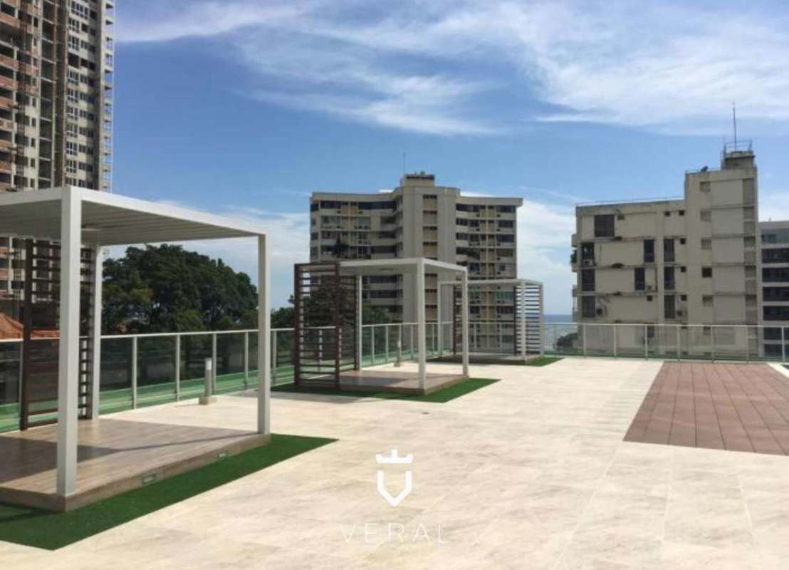 Traditional style living room with chandelier and floor-to-ceiling glass overlooking the Pacific Ocean, Coco del Mar