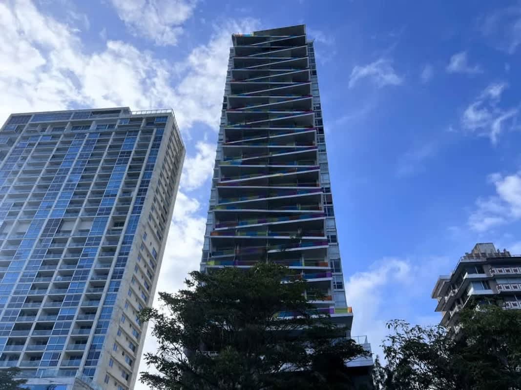 Sundeck lounge area with skyline and ocean views at rooftop PH Element