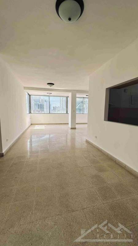 Open plan living and dining area with large windows and city views Punta Paitilla Panama