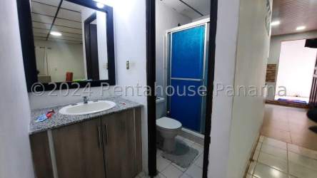 Modern bathroom with granite vanity and enclosed blue shower Vacamonte Arraiján Panama