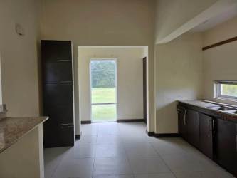 Living area with large sliding glass doors to backyard, vaulted ceilings, exposed beams Rio Hato Panama