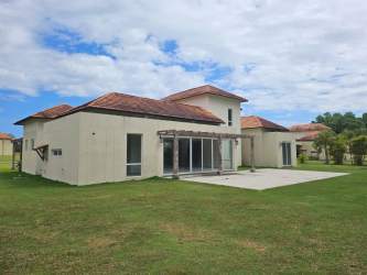 Exterior of Mediterranean style villa with pergola, large yard and sliding doors Royal Decameron Panama