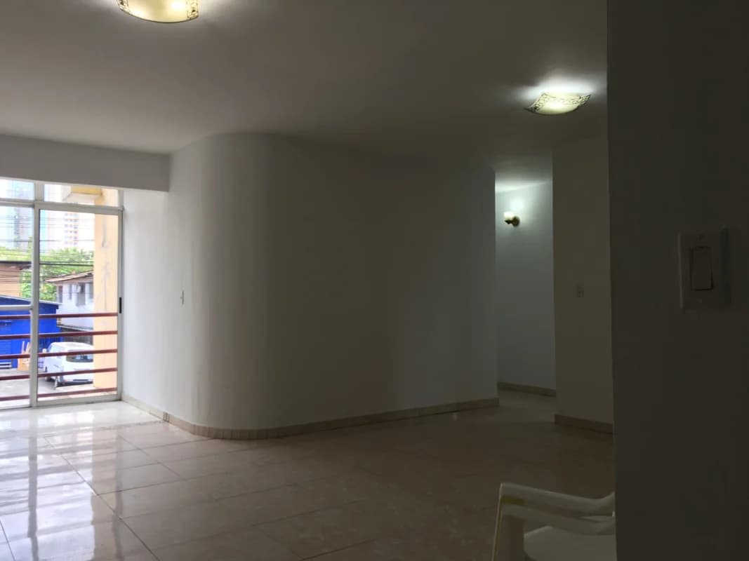 Spacious living dining room with sliding glass door access to balcony at PH D'LIGHT San Francisco Panama