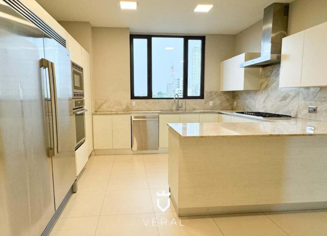 Modern bathroom with marble finish double sinks and glass shower PH Santa Maria Court