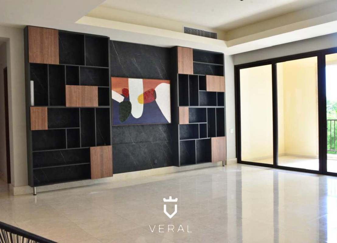 Modern living area with built-in shelving, marble floor, large windows in PH Santa Maria Court Panama