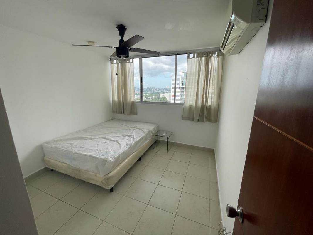 Laundry room with stacked washer dryer and utility sink PH Sky Park Panama City
